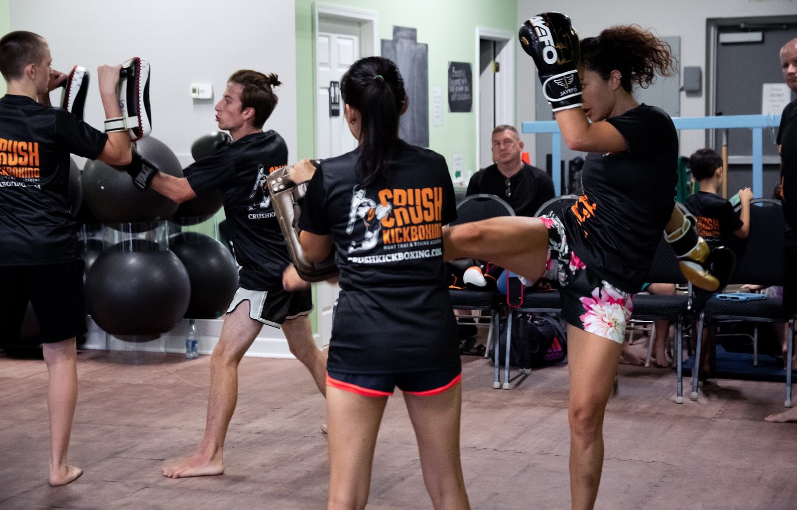 Adult fitness kickboxing class at Crush Kickboxing
